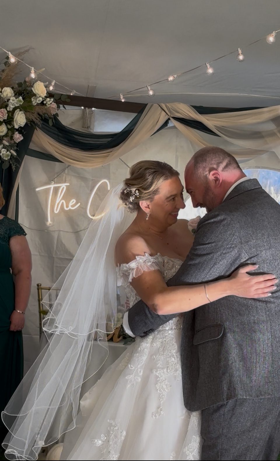 Bride and groom share a tender moment during their wedding ceremony.